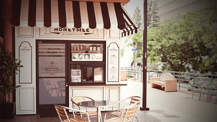 Honeymee Wilshire storefront with striped awning